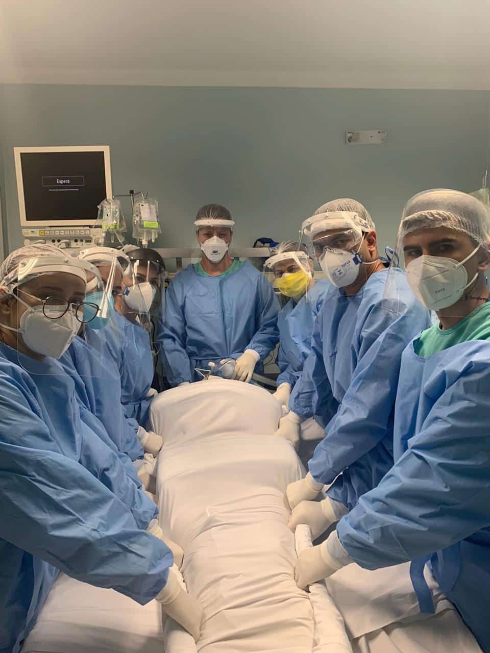 Medical staff about to turn Raquel over