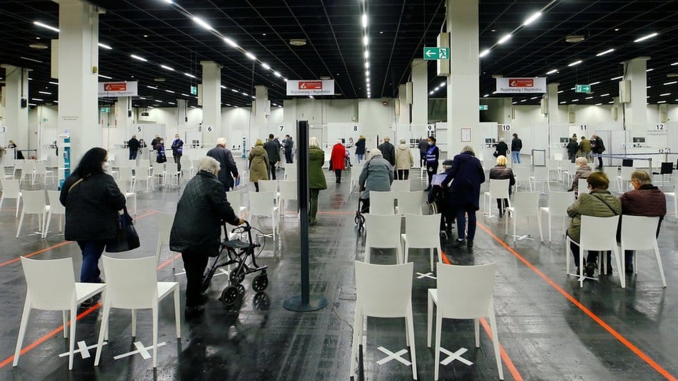 Queues of people waiting for the vaccine at a centre in Cologne, Germany
