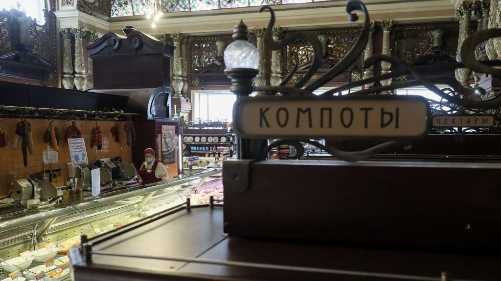 MOSCOW, RUSSIA - MARCH 30, 2021: The Yeliseyevsky store in Tverskaya Street. The store was opened by merchant Grigory Yeliseyev in 1901 as Eliseev's Shop and Cellars of Russian and foreign wines. The store marked the 120th anniversary since its opening on February 5, 2021. Signs read 