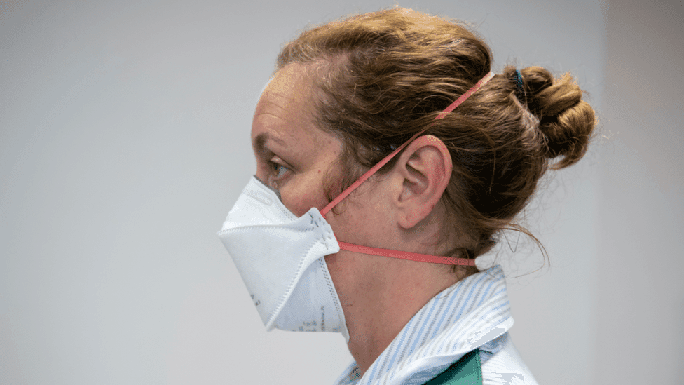 A woman wearing a face mask