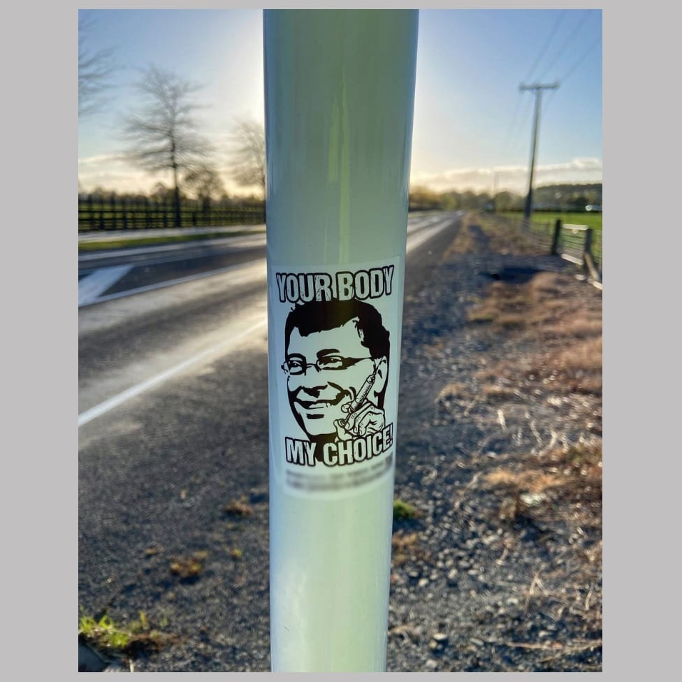 a sticker with Bill Gates head and the slogan 