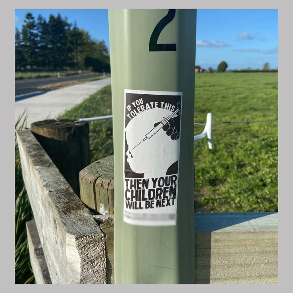 A sticker showing a child being injected and the slogan: 