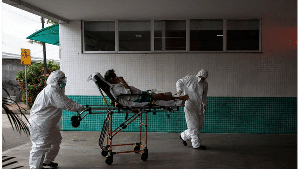 Paramedics taking a Covid-19 patient to hospital in Manaus